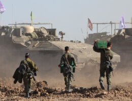 Israeli soldiers walk toward military vehicles in the Gaza Strip, March 10, 2024 (Photo: © Abir Sultan/EFE via ZUMA Press APA Images)