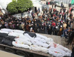 Members of the El-Tabatibi family receive the bodies of 36 relatives who were killed in an Israeli attack on the Nuseirat refugee camp, at the morgue of Al-Aqsa Martyrs Hospital in Deir Al-Balah on March 16, 2024. (Photo: Ali Hamad/APA Images)