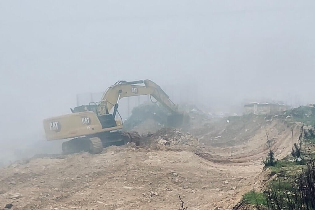 Caterpillar bulldozer used by Israel to illegally take Palestinian farmland under cover of thick fog and Gaza war. (Photo: Noushin Framke)