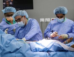 Dr. Ghassan Abu-Sittah, center, performing emergency reconstructive surgery in Gaza during the 11-day war in May 2021.