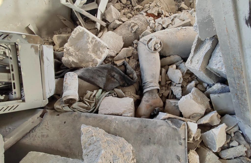 Body buried underneath the rubble at al-Shifa Hospital in Gaza City, April 1, 2024. (Photo: Khaled Daoud /APA Images)