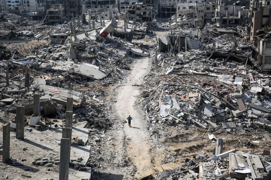 A lone Palestinian walks through the destruction of the vicinity of al-Shifa Hospital, following a two-week military operation by the Israeli army in Gaza City, April 2, 2024. (Credit Image: © Omar Ishaq/dpa via ZUMA Press APAimages)