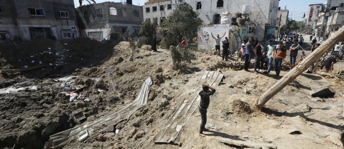 Palestinians inspect the damage and recover items from their destroyed homes following Israeli air strikes on Deir al-Balah in central Gaza.