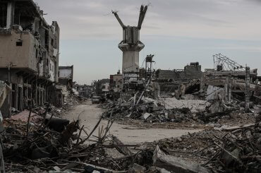 A view of the debris and rubble of destroyed Palestinian buildings along Salahuddin Street in Khan Younis following the withdrawal of Israeli forces from the city on on April 8, 2024. Palestinian families began returning to their homes to assess the damage after the withdrawal, only to find mass destruction. (Photo: Omar Ashtawy/APA Images)