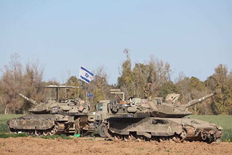 Israeli soldiers on their tanks near the border fence with the Gaza Strip, March 10 2024. (Photo: © Abir Sultan/EFE via ZUMA Press APA Images)