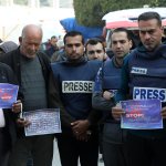 Palestinian journalists protest Israeli crimes against journalists in Gaza, in Deir al-Balah on February 26, 2024. (Photo: Ali Hamad/APA Images)