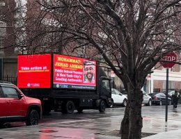 A doxing truck driving through New York City with Mohammad Jehad Ahmad's name and face on it.