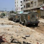 Israeli armored vehicles destroy infrastructure in Jenin refugee camp, May 21, 2024. (Photo: Mohammed Nasser/APA Images)