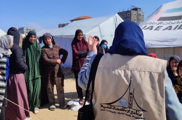 Gaza Community Mental Health Program staff providing psychological support to displaced children, women, elderly people, and people with special needs in evacuation camps in Deir Al-Balah and Rafah, in March 2024. (Photo: Gaza Community Mental Health Program/Facebook)