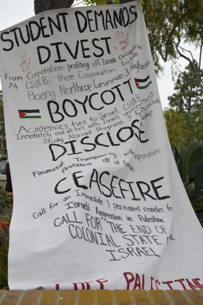 Banner showing student demands as 1,000 CSULB students, faculty, and staff rallied for Palestine on May 2, 2024. (Photo: Ben Huff)