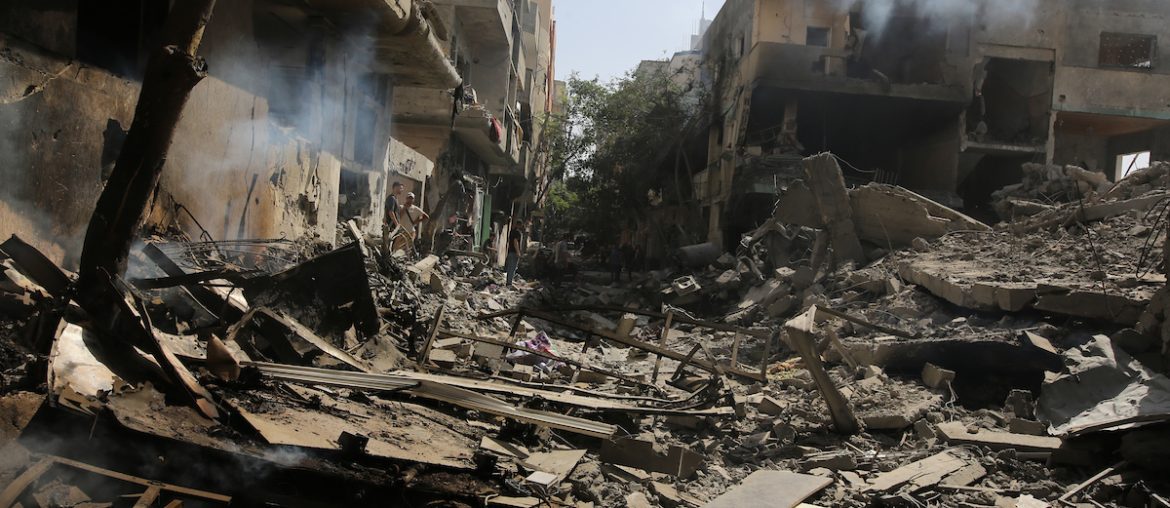 Palestinians gather in front of demolished buildings following the Israeli invasion of the Nuseirat refugee camp in the Gaza Strip, on June 8, 2024. (Photo: Omar Ashtawy / APA Images)