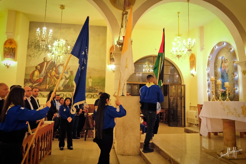 Flag ceremony during the Good Thursday mass at the Holy Family Roman Catholic church in Ramallah, 2024. (Photo: Qassam Muaddi/Mondoweiss)