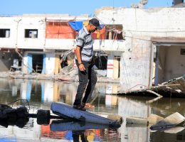 Sewage water fills a street between destroyed buildings in the southern Gaza Strip city of Khan Younis, on July 03, 2024. The UN reports health conditions in the Palestinian coastal enclave of Gaza Strip keep worsening as residents desperately need health care. (Photo: Abdullah Abu Al-Khair/APA Images)