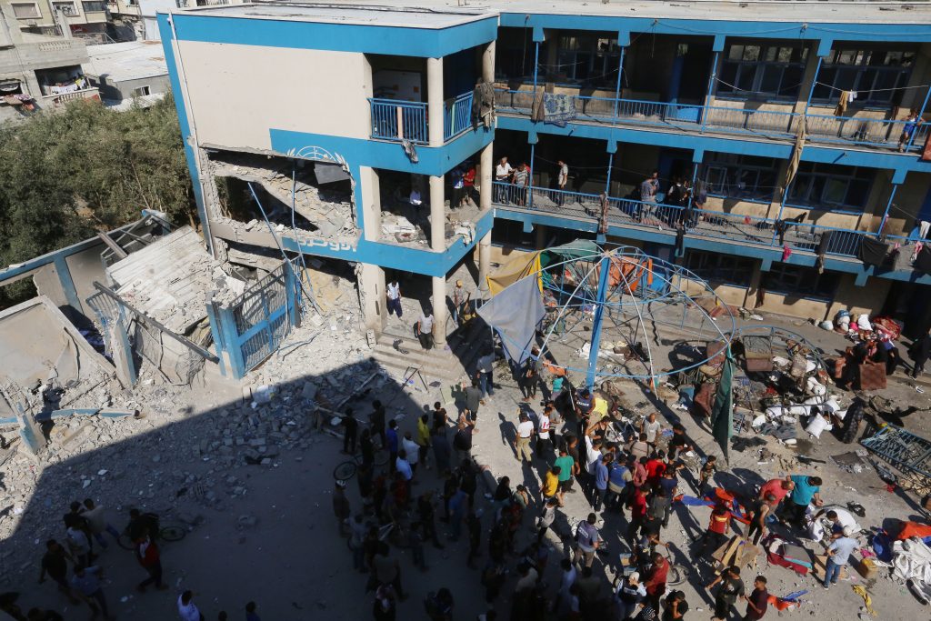 Palestinians survey the damage following the Israeli military bombardment of the UNRWA school-turned-shelter for the internally displaced, July 14, 2024. (Photo: Omar Ashtawy/APA Images)
