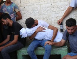 Relatives of Palestinians killed in Israeli attacks mourn as they receive loved ones' bodies from the morgue of Al-Aqsa Hospital for burial in Deir El-Balah, Gaza on July 18, 2024. (Photo: Ali Hamad/APA Images)