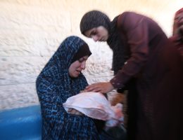 Palestinian women mourn over an infant killed in an Israeli air strike on her home north of Nuseirat, in the central Gaza Strip, on July 19, 2024. (Photo: Ali Hamad/APA Images)