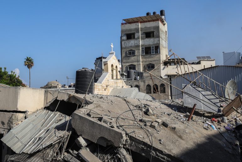 People inspect a destroyed building belonging to the Greek Orthodox Church in Gaza following an Israeli airstrike, on October 20, 2023. (Credit Image: © Mohammad Abu Elsebah/dpa via ZUMA Press APAimages)