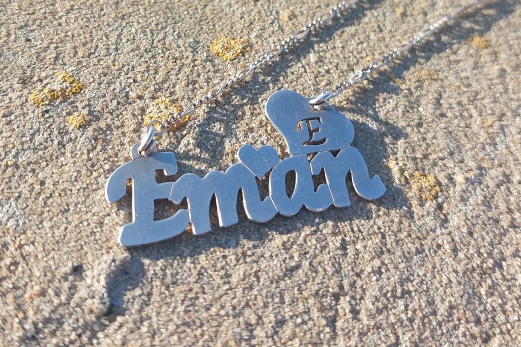 Eman's necklace that her mother gave the author. The photo was taken at Eman's grave.