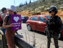 Israeli security forces block Palestinian and Israeli peace activists protesting at the entrance of Huwwara in the West Bank, March 3, 2023. (Photo: Mohammed Nasser/APA Images)