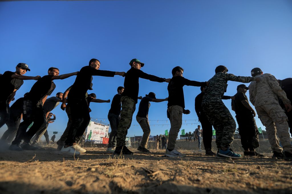 Young men participate in a military summer camp organized by the Qassam Brigades in Khan Younis, August 8, 2023. (Photo: © Yousef Masoud/SOPA Images via ZUMA Press Wire/APA Images)