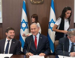 Israeli Prime Minister Benjamin Netanyahu, center, with Israeli Minister of Finance, Bezalel Smotrich, left, at a weekly cabinet meeting, June 18, 2023. (Photo: Ohad Zwigenberg/EFE via ZUMA Press/APA IMAGES)