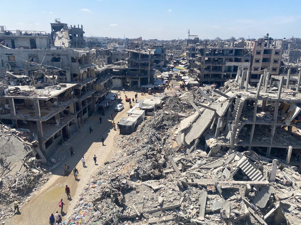 People make their way amid the rubble of buildings destroyed during Israeli bombardment, in the Jabalia camp for displaced Palestinians on August 31, 2024. (Photo: Hadi Daoud/APA Images)