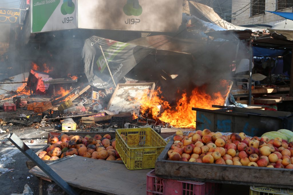 A local market in Jenin catches fire during the Israeli army assault on the city. Jenin’s mayor estimates the city suffered damages in the tens of millions of dollars to property and infrastructure. August 31, 2024. Photo by Shatha Hanaysha.