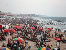 Palestinians enjoy their time on the beach of Gaza City on a hot day, July 1, 2022. (Photo: Mohammed Dahman/APA Images)