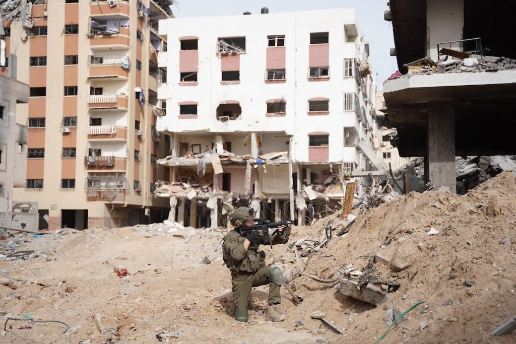 A photo released by the Israeli military on Dec. 3, 2023 shows Israeli troops conducting military operations in the Gaza Strip. (Photo: © Xin Hua/Xinhua via ZUMA Press APA Images)