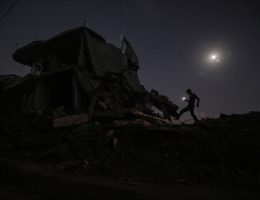 Palestinians gather around a light source as they struggle with power outages due to Israeli attacks that destroyed the infrastructure in Gaza City, Gaza on October 13, 2024. (Photo by Omar Ashtawy apaimages)