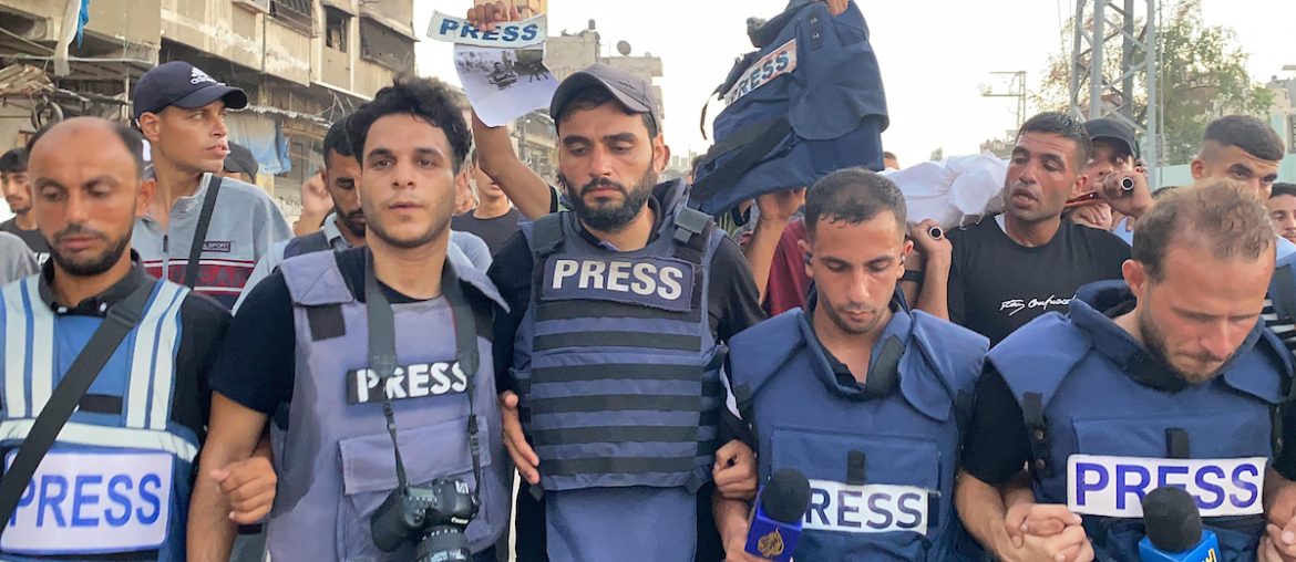 Mourners and colleagues surround the bodies of Al-Jazeera Arabic journalist Ismail al-Ghoul and cameraman Rami al-Refee, killed in an Israeli strike during their coverage of Gaza's Al-Shati refugee camp, on July 31, 2024. (Photo: Hadi Daoud/APA Images)