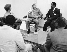 Yasser Arafat, Executive Committee Chairman of the Palestine Liberation Organization (PLO), addressed the International Conference on the question of Palestine this morning, following which general debate resumed on ways for the Palestinian people to achieve their inalienable rights. Seen in an informal meeting before Mr. Arafat's address this morning are, clockwise from extreme left,: Nabil Ramlawi (PLO), Permanent Observer to the UN Office at Geneva (UNOG); Lucille Mair, Secretary-General, International Conference on the Question of Palestine (ICQP); Yasser Arafat; Mustapha Niasse (Senegal), President of ICQP; Erik Suy, Director-General, UNOG; (with backs to the camera) Massamba Sarre (Senegal), Chairman, Committee on the Exercise of the Inalienable Rights of the Palestinian People; and Alioune Sene (Senegal), Permanent Representative to UNOG. (Photo: United Nations Archive)