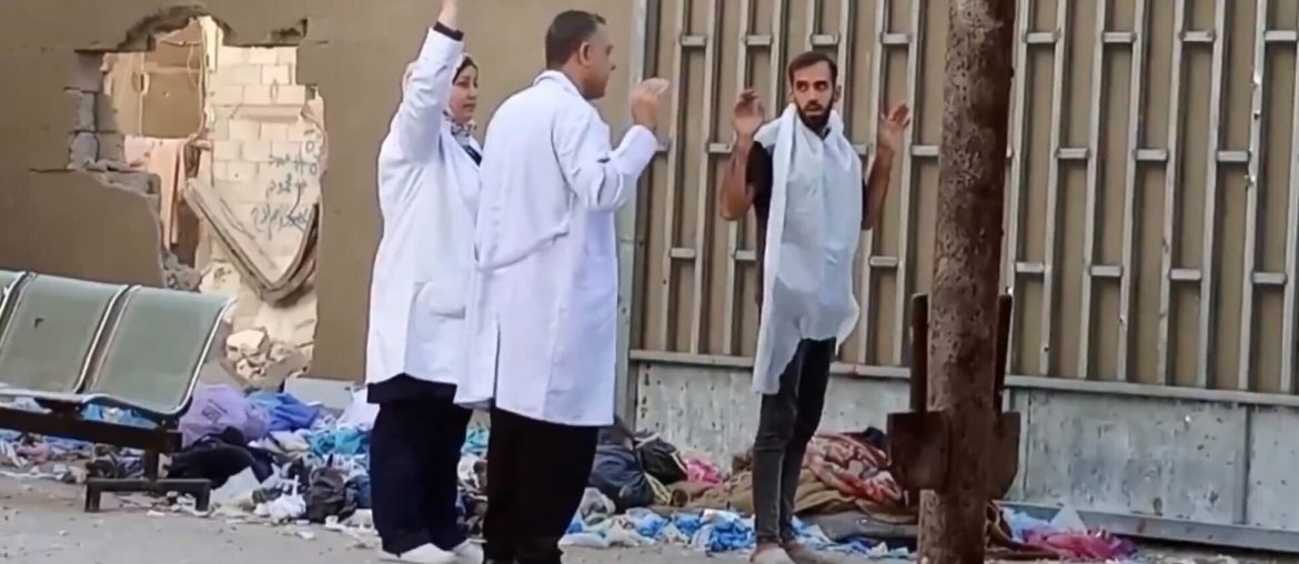 Director of Kamal Adwan Hospital, Husam Abu Safiyeh (middle), holds up his hands during the Israeli invasion of the hospital, October 26, 2024. (Photo: Screenshot/Social Media)