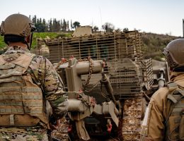 Lebanese forces stand guard as Israeli military bulldozers work near the fence at the Lebanese border on January 22, 2023. (Photo: Fatma Jomaa/APA images)