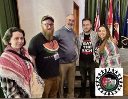 UAW President Shawn Fain poses for a photo with members of UAWL4P shortly after saying he will vote for divestment, October 7, 2024.