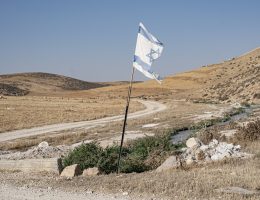 A torn Israeli flag is seen on the road to the Mahharza residence in the South Hebron Hills of the West Bank placed by settlers from an outpost (illegal settlement) nearby.