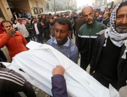 Relatives and well-wishers offer prayers during the funeral of Palestinians who were killed in an Israeli strike on the Nuseirat refugee camp in the Gaza Strip, on December 7, 2024. (Photo: Omar Ashtawy/APA Images)