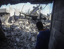 People inspect a destroyed house in the Nuseirat refugee camp, central Gaza.