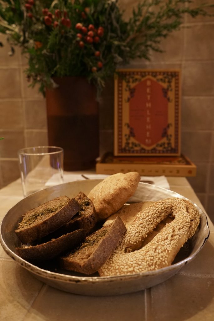 Baked goods at Louf, including Ka'ak, with Fadi Kattan's cookbook, Bethlehem: A Celebration of Palestinian Food, in the background. (Photo: Jack Dodson/©Louf restaurant)