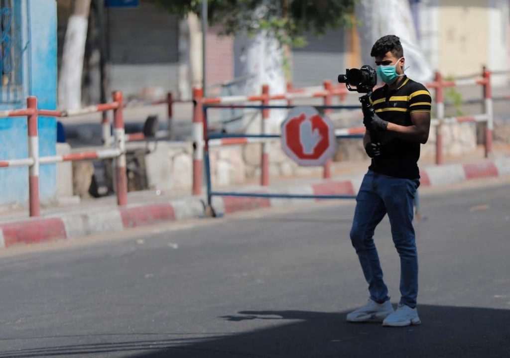 Haitham photographing the streets of Gaza City in 2023 (Photo courtesy of the Abd Elwahed family)