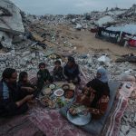 Palestinian Karam Abu Haloub and his wife Faten prepare iftar food during the third day of the holy month of Ramadan in a tent they set up on the ruins of their destroyed home in the Al-Shimaa area of Beit Lahia in the northern Gaza Strip, March 3, 2025. Thousands of Palestinian families in the Gaza Strip live in tents amidst a lack of basic necessities after the Israeli war on the Gaza Strip. (Photo by Omar Ashtawy/ apaimages)