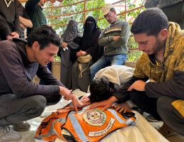 Palestinian Civil Defense members mourn their colleague Anwar al-Attar during his funeral at Nasser Medical Complex in Khan Yunis, southern Gaza, March 28, 2025. (Photo: Doaa el-Baz/APA Images)