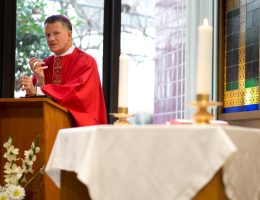 Archbishop Timothy Broglio administers communion at Travis Air Force Base on February 3, 2014. (Photo: U.S. Air Force photo/Ken Wright)
