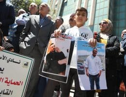 Demonstrators carry posters and portraits of Palestinian prisoners in Israeli jails during a gathering to commemorate Palestinian Prisoners' Day in the city of Hebron in the Israeli-occupied West Bank on April 17, 2025. (Photo: Mamoun Wazwaz/APA Images)