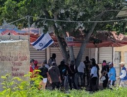 Activists at an anti-Haitian rally called by the Ancient Dominican Order (AOD) fly the Israeli flag moments before violence erupts, on March 30, 2025. (Photo: Carmen Parsons)