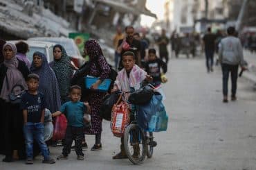 Palestinians leave west Gaza with their belongings following Israeli evacuation orders on May 14, 2025. (Photo: Omar Ashtawy/APA Images)
