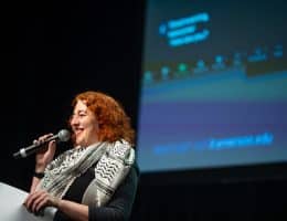 Anna Feder introducing the 23rd Emerson College Film Festival in the Paramount Theatre on March 20, 2024. (Photo: Christopher McIntosh)