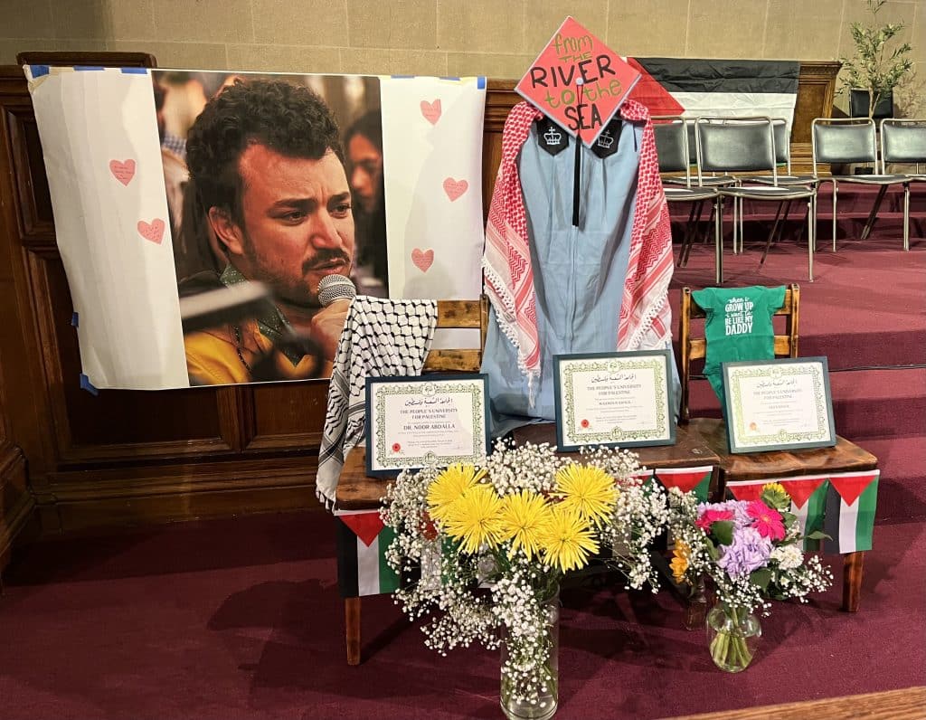 The stage at the People's Graduation featuring a large photo of Mahmoud Khalil, at the Church of St. Paul and St. Andrew in New York City on May 18, 2025. (Photo: Nancy Kricorian)