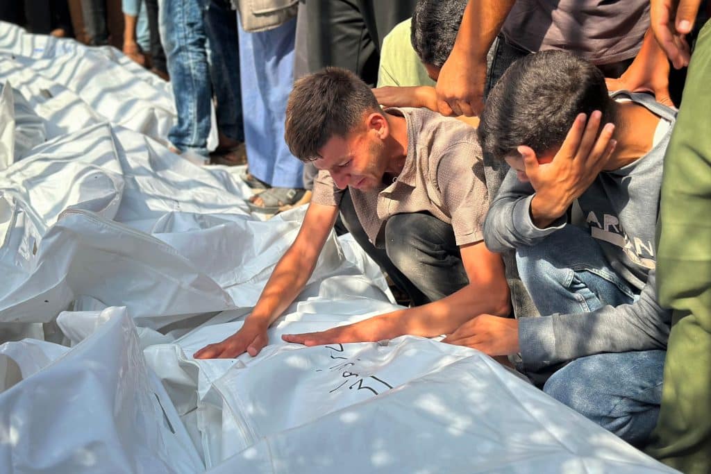 Relatives of Palestinians who were killed, including children, mourn in Nasser hospital after an Israeli bombing at a school sheltering displaced people in Khan Younis in the southern Gaza Strip, on June 4, 2025. (Photo by Moaz Abu Taha / apaimages)