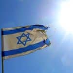 An Israeli flag flying in the sun. (Photo: Flickr/Justin LaBerge)